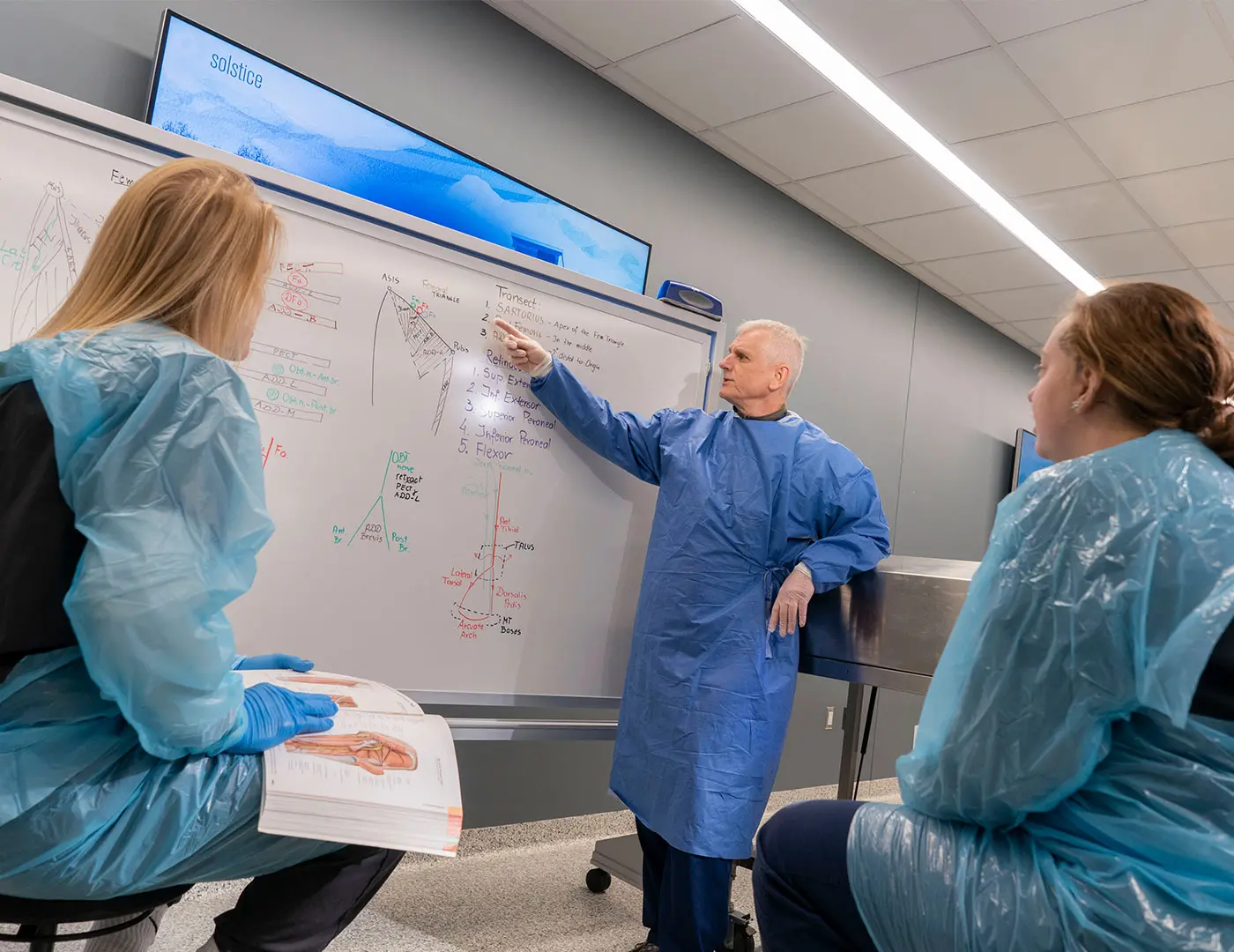 Dr. Andrew Milosz instructs athletic training students in the cadaver lab