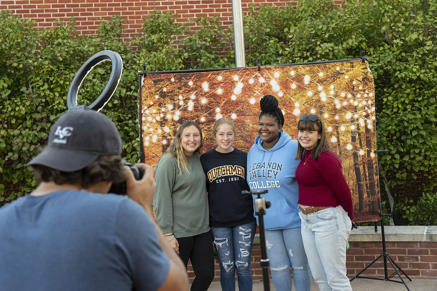 Lebanon Valley College students pose at fall fest photo booth
