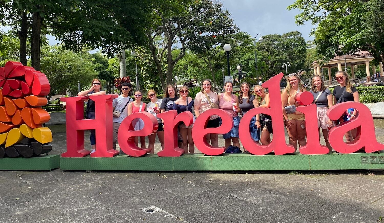 LVC students pose with Heredia sign in Costa Rica