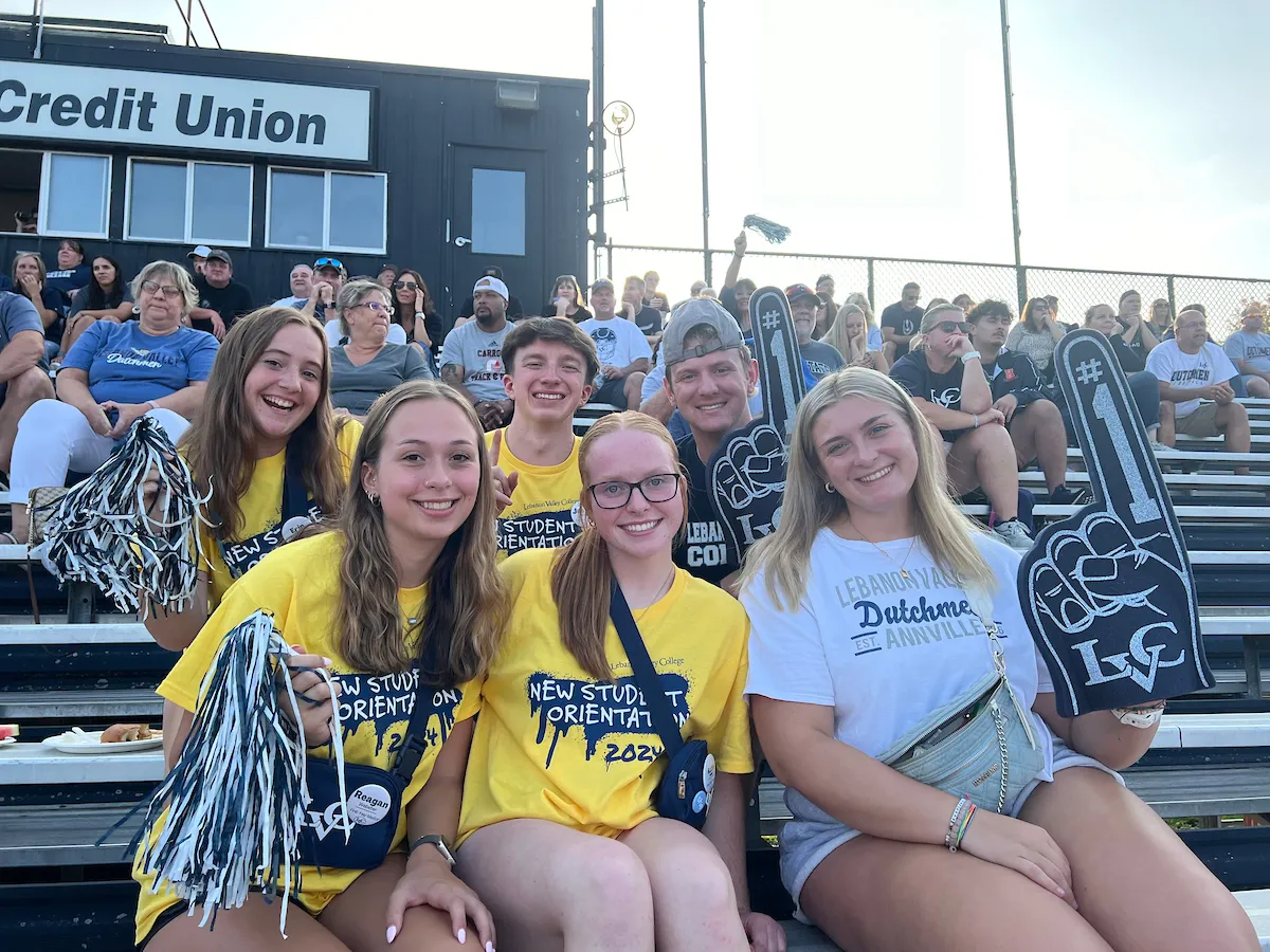 Students cheer in the stands at a football game. Student life, campus life. August 2024.