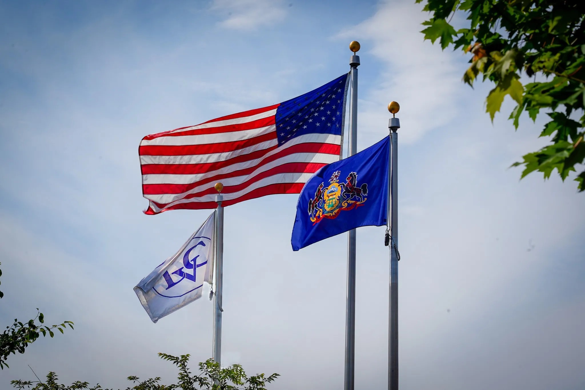 US and LVC flags wave in breeze