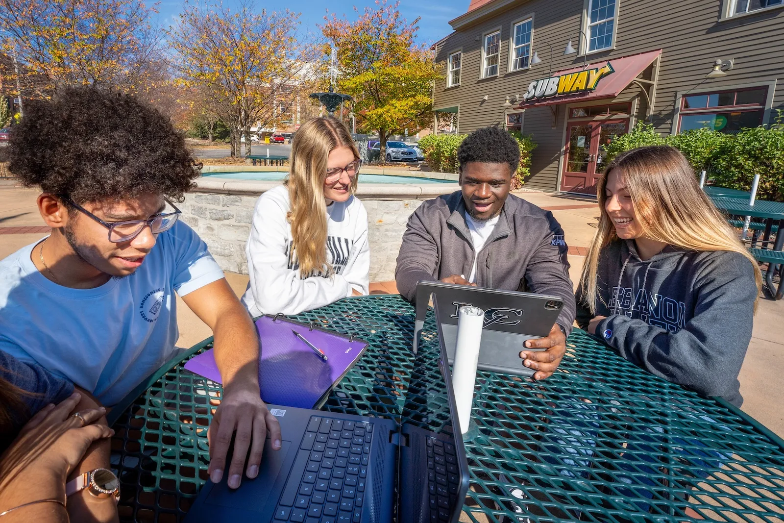 Manny Rosario Martinez, Clarissa Prosser, Reinhold Louis, Ashley Duchnowski sit in front of Subway near LVC campus