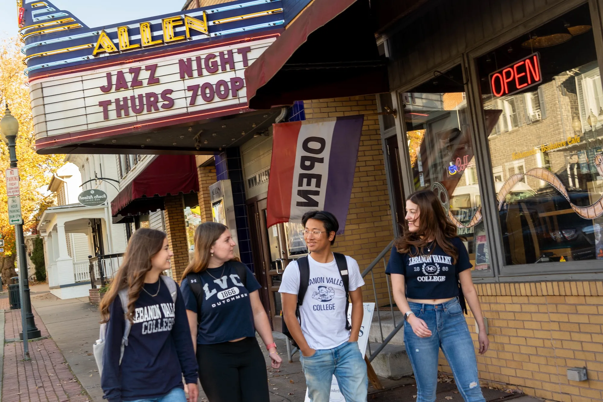 Lauren Frazier, Cora Null, Michael Frentzen, and McKenna Kerley walk past the Allen Theater in downtown Annville