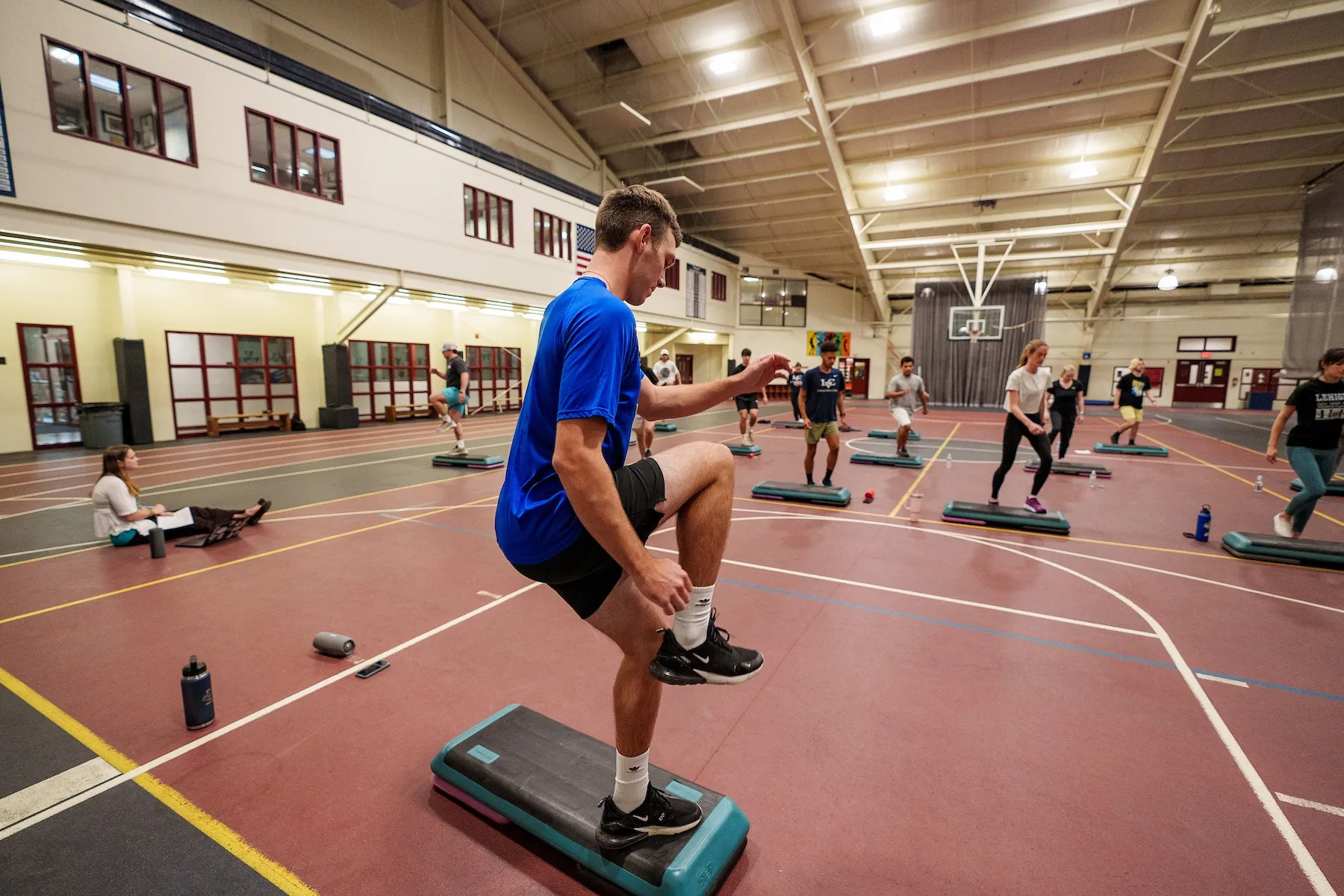 Exercise science class does cardio workout in Arnold Sports Center Arena